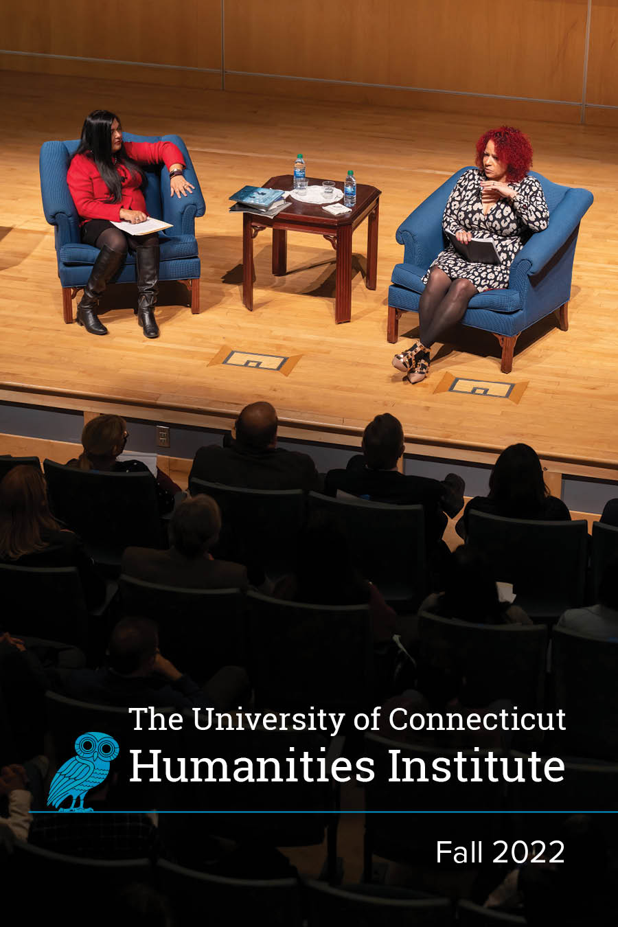 Cover of the Fall 2022 year in review booklet, featuring an image of Manisha Sinha and Nikole Hannah-Jones together on stage, conversing. Members of the audience, in shadow, listen attentively.